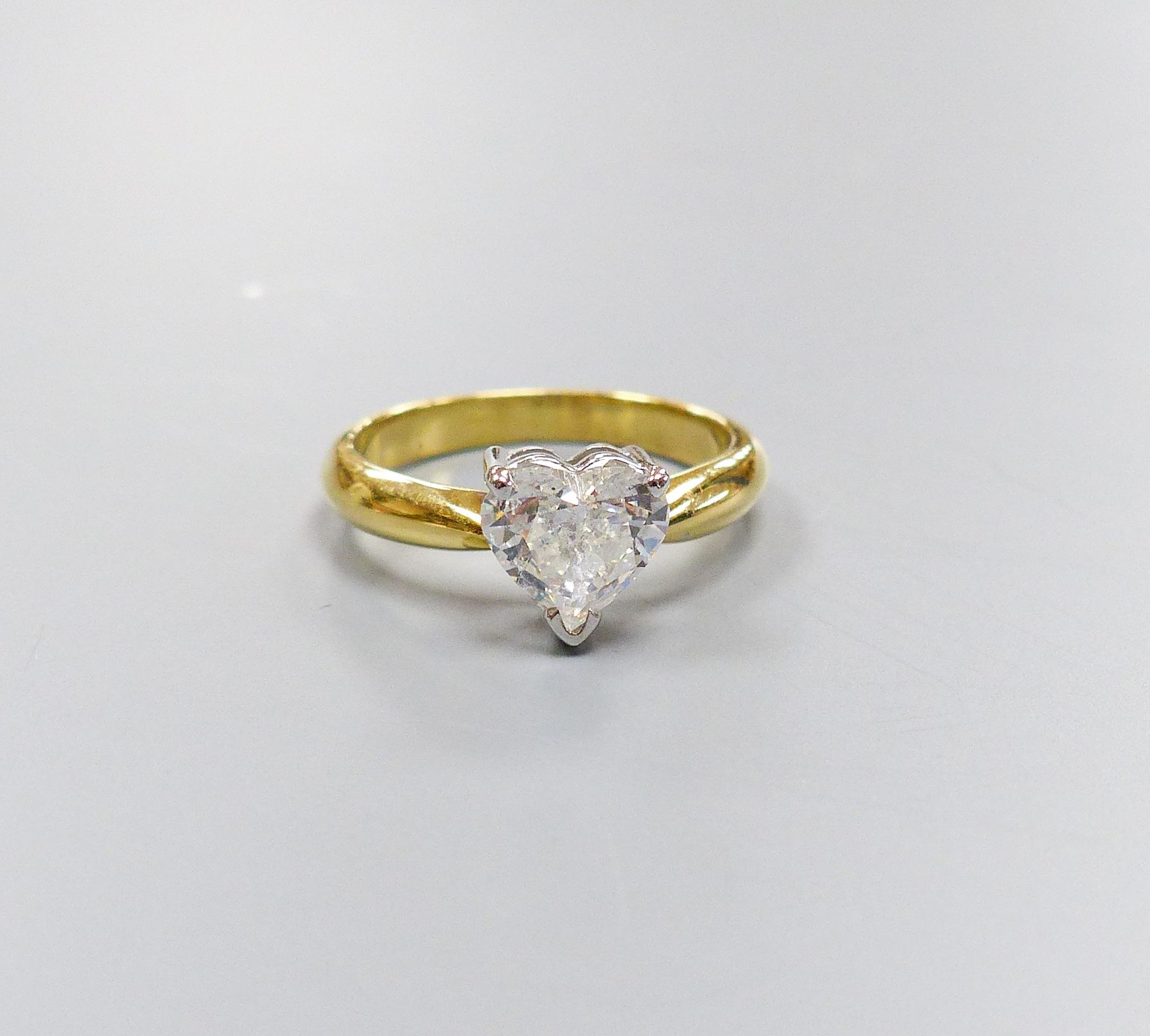 A modern 18ct gold and solitaire heart shaped diamond ring, size K, gross weight 3.6 grams